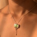 Damru 92.5 sterling silver pendant with green and yellow enamel