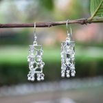 92.5 sterling silver cylindrical jali jhumkis inspired by Jharokha Jali patterns